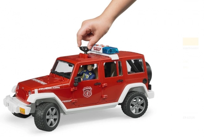 Bruder Červený požární JEEP WRANGLER s figurkou a příslušenstvím