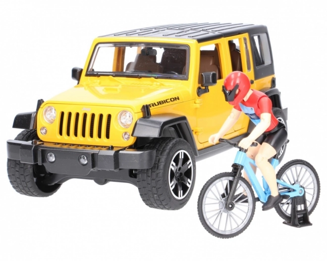 Bruder Jeep Wrangler Rubicon s cyklistou a kolem