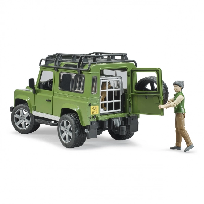 Bruder LAND ROVER DEFENDER s figurkou myslivce, psa a příslušenstvím