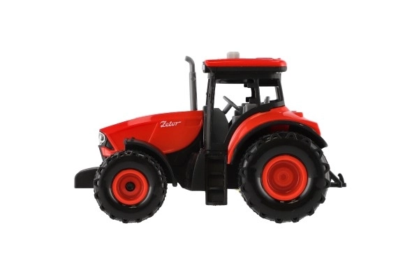 Červený traktor Zetor na setrvačník se zvukovými a světlenými efekty