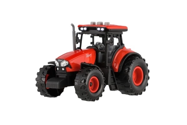 Červený traktor Zetor na setrvačník se zvukovými a světlenými efekty